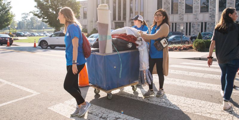 Students push a cart full of belongings during fall move-in. Photo by Christina Franusich for Virginia Tech.